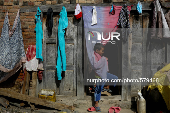 A kid is playing. Sankhu, Nepal. May 3, 2015. 
