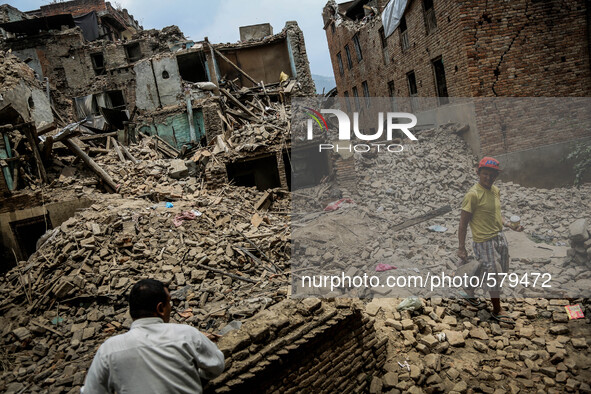 People are cleaning the rubbles in the destroyed buildings. Sankhu, Nepal. May 9, 2015. 