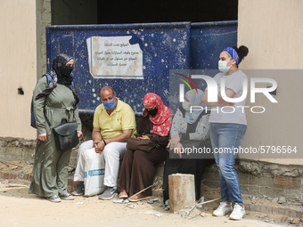 one of parents waiting the students exit outside the examination committee during the first day of high school exams in Giza Governorate, Eg...