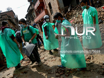 Volunteers are working to clean up the rubbles. Sankhu, Nepal. May 9, 2015 (