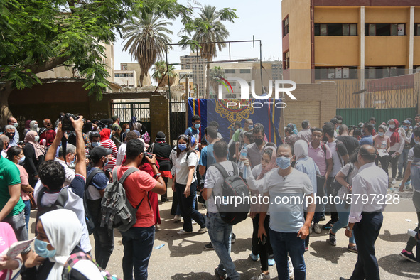 Hustle during the students ’exit from the Examination Committee during the first day of the high school exams in Giza Governorate, Egypt, on...