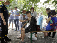 Doctors and Ministry of Emergencies workers give help to people, after a suspected gas explosion in Kiyv, Ukraine, on 21 June 2020. As a res...