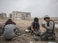 The boys at Al-Mliha, Syria on September 2, 2019 in the first phase of melting cooper, they filter the stuff and prepare it for the next pha...