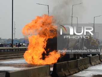 Fire fighters at the scene of a gas explosion involving four articulated vehicles on the Kara bridge section of Lagos-Ibadan expressway on J...