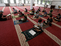  Boys keeping a safe distance from each other,attend a Koran memorization class as Palestinians ease the coronavirus disease (COVID-19) rest...