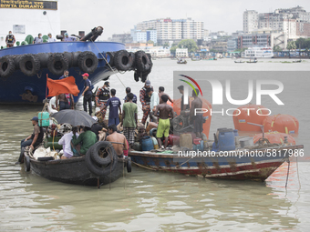 Rescue team carry on rescue works the day after a ferry capsized in the Buriganga River in Dhaka on June 30, 2020. At least 32 people died a...