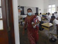 A teacher came outside near the classroom in Colombo, Sri Lanka July,7,2020
Sri Lankan Government announced the reopening of school for stu...
