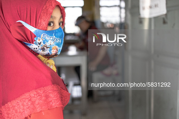 A little girl wait for her turn for the school test at Depok, West Java, Indonesia, on July 6, 2020.  The Education and Culture Ministry has...