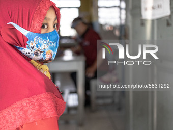 A little girl wait for her turn for the school test at Depok, West Java, Indonesia, on July 6, 2020.  The Education and Culture Ministry has...