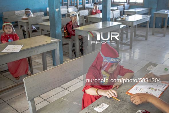 A little girl during her psychological test for selection entering the school at Depok, West Java, Indonesia, on July 6, 2020.  The Educatio...