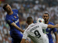 Real Madrid's French forward Karim Benzema and Juventus' Swiss Defender Stephan Lichtsteiner during the Champions League 2014/15 semifinals...