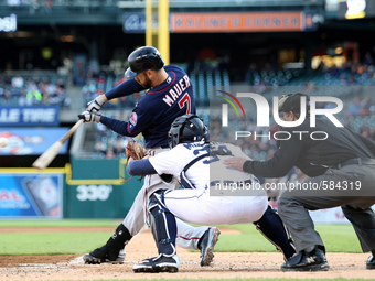 Minnesota Twins' Joe Mauer hits a triple on the third inning of a baseball game against the Detroit Tigers in Detroit, Michigan USA, on Wedn...