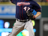 Minnesota Twins starter Ricky Nolasco delivers a pitch in the sixth inning of a baseball game against the Detroit Tigers in Detroit, Michiga...