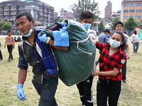 Relief distribution team members are carrying relief for the people of make shift camp near Kathmandu, May 14, 2015 (