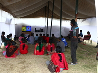 People in make shift camp are watching TV for entertainment. Kathmandu May 14, 2015 (