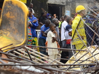 A digger clear the rubbles of the destroyed building, where three persons have been confirmed died and nine injured following a building col...