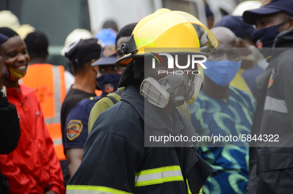 A rescue worker look on at site of a collapsed building, where three persons have been confirmed died and nine injured following a building...