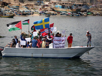 Palestinians ride boat in the Mediterranean Sea off the coast of Gaza City May 14, 2015, during a rally To receive Ship Marianne. Israeli au...