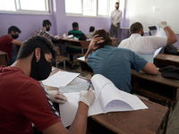 Syrian students in Idlib province take the middle school exam while maintaining safety procedures against the Coronavirus on July 12, 2020 (