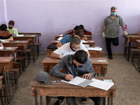 Syrian students in Idlib province take the middle school exam while maintaining safety procedures against the Coronavirus on July 12, 2020 (