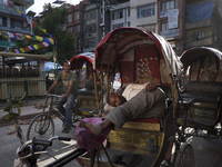 KHATMANDU, NEPAL-- May 14, 2015- Cycle rickshaw drivers in the old city of Kathmandu. The city is slowly getting back to normal after two re...