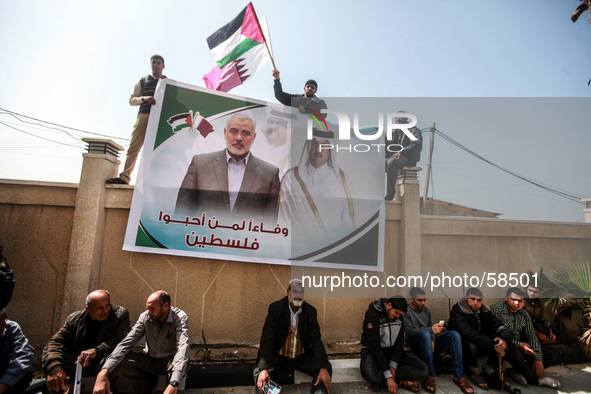 Palestinians take part in a demonstration in front of representative office of Qatar to give thanks to the State of Qatar for the permanent...