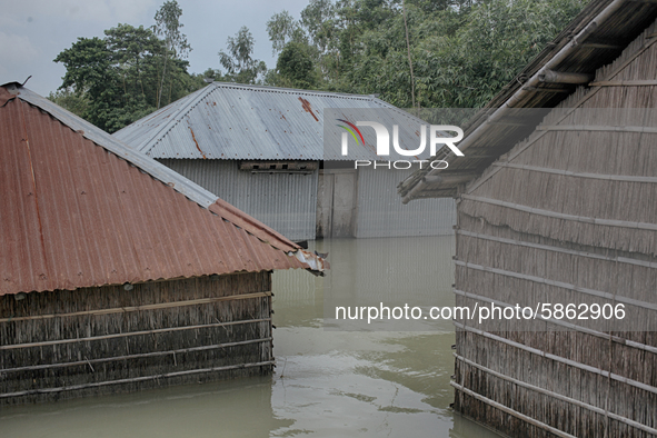 Houses are seen drowned underwater as the flood occurred at Jatrapur area in Kurigram, Bangladesh on Saturday, July 18, 2020. 