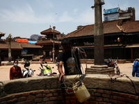 A man is collecting water from well, Bhaktapur May 5 2015 (