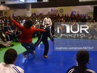 Indian girl students  performing  their martial arts skills during the  Kolkata police programme for  Learning self-defence is now a necessi...