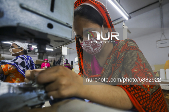 Ready made garments workers works in a garments factory in Dhaka on July 25, 2020. 