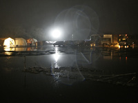 March 16, 2011-Sendai, Japan-Night view of international rescue camp at Miyagi sports complex parking lot in Sendai on March 16, 2011, Japan...