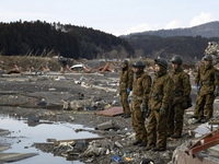 March 17, 2011-Sanriku Minami, Japan-Japanese Military search for mud under burial missing person at Tsunami hit Destroyed city in Sanriku M...