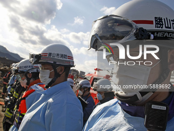 March 18, 2011-Rikuzen Takata, Japan-Rescue Team held on simple funeral for victim at Debris and Mud covered on Tsunami hit Destroyed city i...