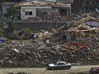 March 20, 2011-Rikuzen Takata, Japan-Police patrol around hazard area on debris and mud covered at Tsunami hit Destroyed city in Rikuzentaka...