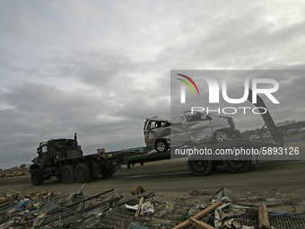 March 22, 2011-Sendai, Japan-U.S. Marine take part in an recovery operation  clean up to debris and mud covered at Tsunami hit Destroyed Air...
