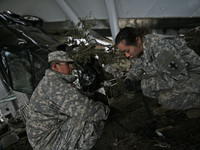 March 22, 2011-Sendai, Japan-U.S. Marine take part in an recovery operation  clean up to debris and mud covered at Tsunami hit Destroyed Air...
