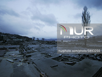 March 24, 2011-Sanriku, Japan-Snow falling on debris and mud covered at Tsunami hit Destroyed empty village in Sanriku on March 24, 2011, Ja...