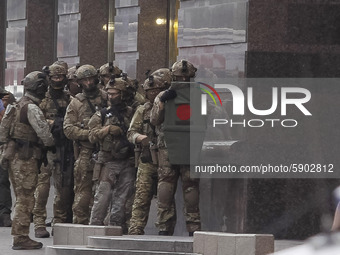 Members of special forces prepare to detain a man who threatens to detonate a bomb at a bank office in center of Kyiv, Ukraine, on 03 August...