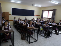 Palestinian schoolchildren sit inside a classroom in the rosary sisters school gaza , on the first day of a new school year, as Palestinians...