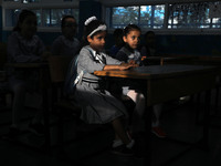 Palestinian students sit in a classroom at a United-Nations run school as a new school year begins as Palestinians ease the coronavirus dise...