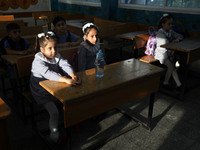 Palestinian students sit in a classroom at a United-Nations run school as a new school year begins as Palestinians ease the coronavirus dise...