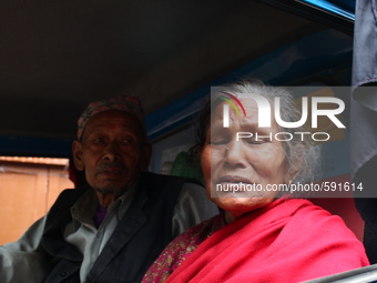 An old woman is crying because she is leaving her house and migrating to her village, Bhaktapur, Nepal (