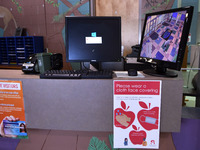 Heath safety precautions are seen posted at the reception desk at Layer Elementary School a week before classes begin for the school year du...