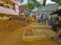  Vehicles submerged in mud as landslide brought in sand to low laying areas after the heavy rainfall at Sundar Nagar Ganesh Vihar colony,Lal...