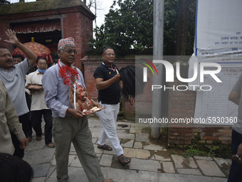 A Nepalese devotee carry's an idol statue of Bagh Bhairab after rituals, due to the covid-19 pandemic, less number of Nepalese devotees arri...