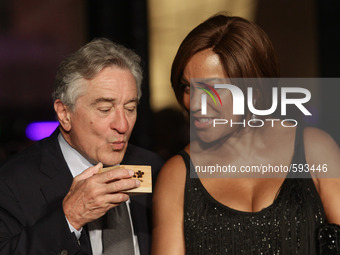 Pasay City, Philippines - Actor Robert De Niro (L) with wife, Grace Hightower De Niro (R) drink sake during the opening of Nobu Hotel in Pas...
