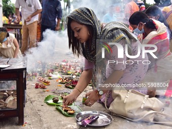 Devotees lighting the earthen lamp to offer prayers to Lord Ganesha on the occasion of Ganesh Chaturthi, amid the ongoing coronavirus pandem...