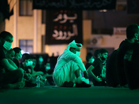 Muslim attend ritual as Shiite Muslims commemorate Ashura during the Islamic month of Muharram in Bahrain on August 23, 2020. Reviving the A...