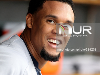 Milwaukee Brewers' Carlos Gomez celebrates his solo home run in he dugout during the first inning of a baseball game against the Detroit Tig...