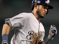 Milwaukee Brewers Luis Sardinas scores a run on a single hit by Carlos Gomez during the seventh inning of a baseball game against the Detroi...